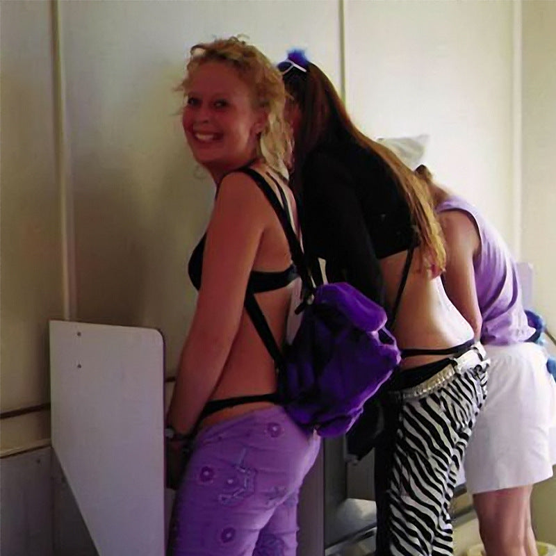 A woman uses Portable Standing Urinal 