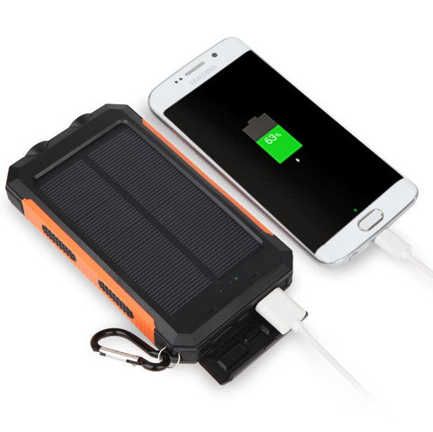 Charging phone with Portable Solar Panel Power Bank.