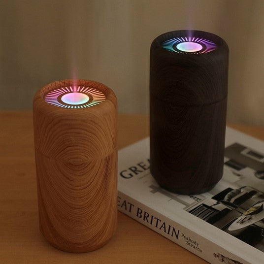 Dark and Brown USB Car Humidifier with Colorful Light on a desk