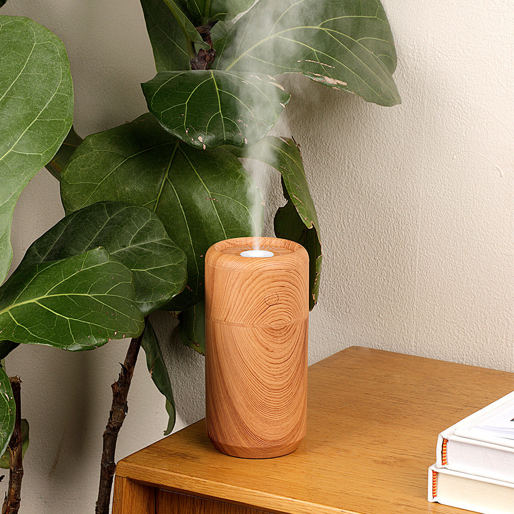 Wood USB Car Humidifier with Colorful Light on a desk